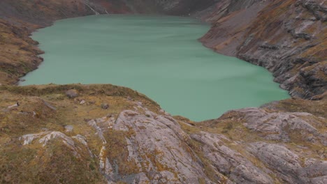 Landscape-of-El-Altar-Lagoon-Crater-Lake-on-Top-of-Volcanic-Mountain-in-Ecuador,-Aerial-View