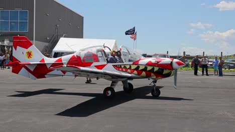 Scottish-Aviation-SK-61-Bulldog-with-unique-paint-job-taxiing-in-front-of-a-hanger-at-an-airshow-at-Centennial-Airport-in-Colorado