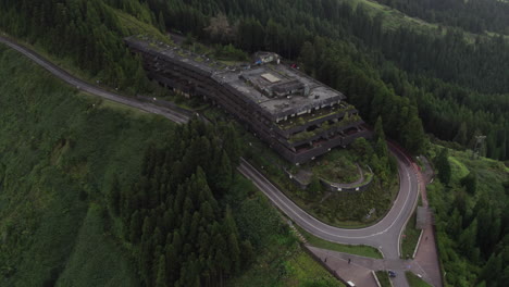 Aerial:-Monte-Palace-hotel-ruins-amidst-lush-São-Miguel-forests-Azores