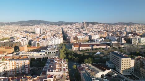 Aerial-View-Above-Eixample,-Barcelona,-Spain-with-Sagrada-Familia-Church-in-Background