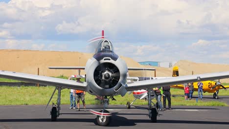 North-American-T-28-Trojan-vintage-aircraft-taxiing-to-a-parking-space-at-an-airshow-at-Centennial-Airport-in-Colorado