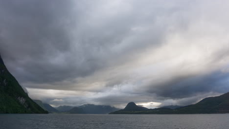 Timelapse-of-cloudy-weather-over-a-beautiful-fjord-in-summer