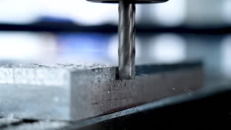 The-head-of-the-metal-cutting-machine-at-the-moment-of-cutting-the-metal-and-removing-the-impurities