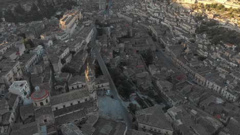 Drone-view-of-Cathedral-of-Saint-George-in-historic-town-of-Modica,-aerial