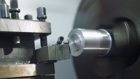 Metal-lathe-machine-while-shaping-and-cutting-a-piece-of-metal