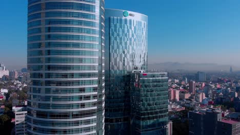 aerial-view-tall-buildings-Mexico-city-reforma-avenue-city-landscape-morning-light-clear-blue-sky