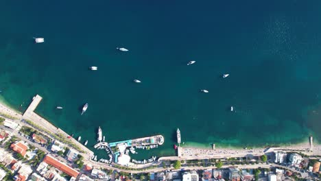 Aerial-Views-of-Saranda's-Coastal-Beauty:-Azure-Bays,-Seaview-Hotels,-and-the-Enchanting-Saranda-Coast-from-Above