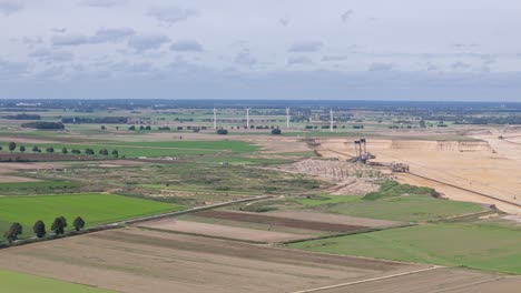 Garzweiler-brown-coal-mine-expanding-into-farmland,-aerial-view