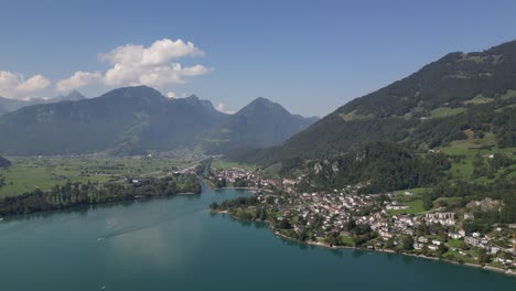 Aerial-drone-view-of-Walensee-lake,-Switzerland-with-boats