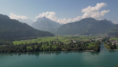 Beautiful-aerial-view-of-the-mountains-seen-from-Walensee-lake,-Switzerland-with-blue-sky