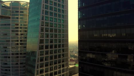 drone-shot-revealing-tall-buildings-golden-hour-Mexico-city