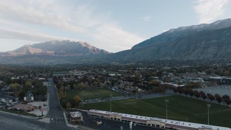 Provo,-Utah-at-the-foot-of-the-Wasatch-Front-Mountains-at-sunrise---aerial-flyover