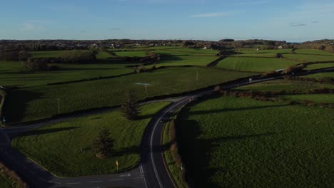 Aerial-view-over-vehicles-restriction-to-20-miles-per-hour-speed-limit-in-rural-farming-countryside