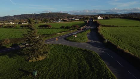 Aerial-view-towards-vehicles-restriction-to-20-miles-per-hour-speed-limit-in-rural-farming-countryside