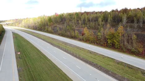 Drone-view-of-a-car-passing-over-a-toll-road