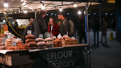 Buying-bread-at-'The-Flour-Station',-Kings-Cross,-London,-United-Kingdom