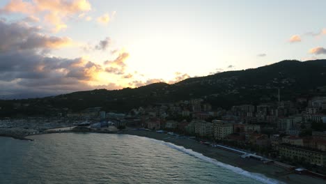 Flying-toward-Ligurian-Varazze-town-of-Liguria-region-in-Italy-at-sunset