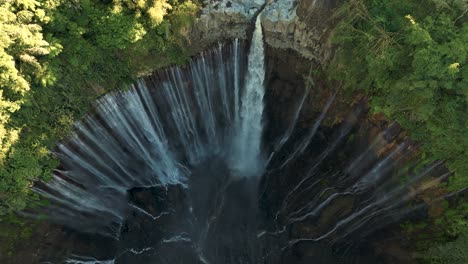 Aerial-view-of-wonderful-Tumpak-Sewu-waterfall-in-the-tropical-forest-at-Lumajang,-East-Java---Indonesia