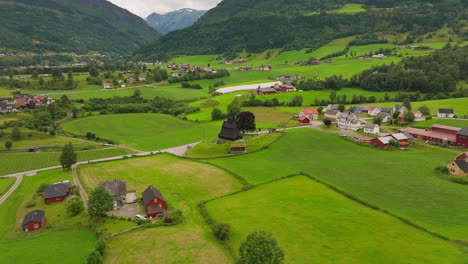 Hopperstad-Stave-Church-in-lush-countryside,-Vikoyri,-Vik,-Norway