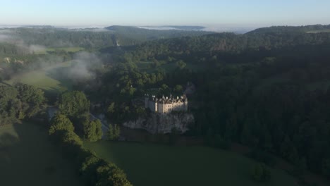 Wide-view-of-Walzin-castle-surround-by-nature-at-Belgium,-aerial