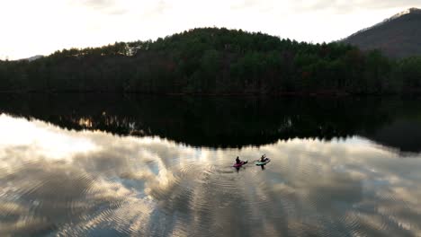 Paddle-boarding-on-Lake-Santeetlah,-North-Carolina-during-golden-hour