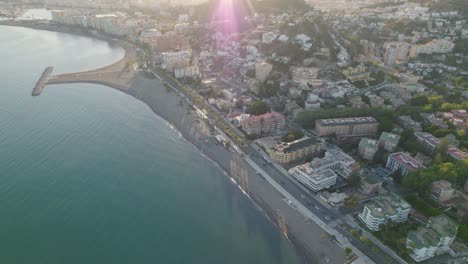 Drone-flying-over-the-city-by-the-beach