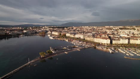 Lake-Geneva-with-Jetee-de-Paquis,-4K-drone-shot