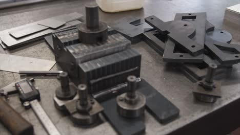 Tools-sitting-on-industrial-metal-work-surface