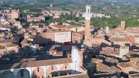 Piazza-del-Campo-Dramatic-aerial-top-view-flight-medieval-town-Siena-Tuscany-Italy