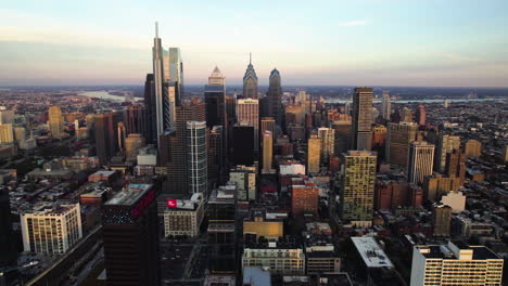 Aerial-circling-shot-in-front-of-downtown-Philadelphia,-sunset-in-Pennsylvania,-USA