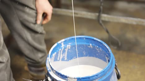 Dripping-paint-into-paint-pot