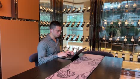 Wealthy-Asian-Millennial-Entrepreneur-Man-Typing-on-Laptop-Inside-Luxurious-Home