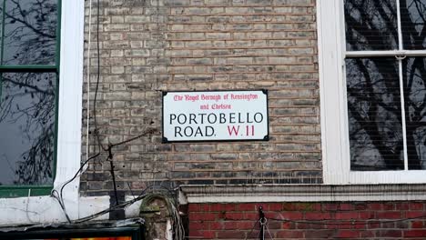 Static-handheld-shot-of-the-street-sign-of-Portobello-Road-in-London