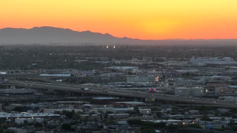 Urban-sprawl-of-Phoenix,-Arizona-at-sunset