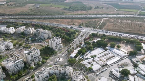 Top-aerial-view-of-a-busy-road-junction-and-traffic-junctions-in-the-city-in-central-Israel