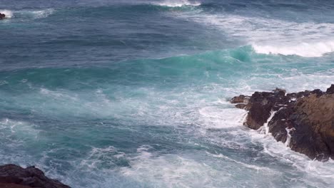 Waves-crashing-and-slashing-on-a-volcanic-rock-coast