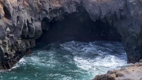 Waves-crashing-and-splashing-on-the-volcanic-rock-wall-of-Los-Hervideros-in-Lanzarote