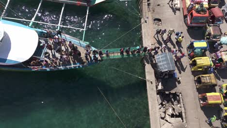 Passengers-disembarking-from-a-boat-at-Surigao-harbor-using-a-gangway