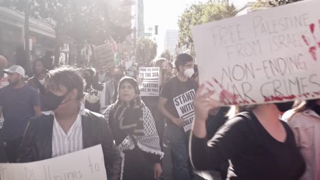 People-protesting-in-downtown-San-Jose,-CA-for-the-Palestine-and-Israel-war