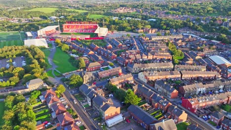 Aerial-panoramic-overview-of-tightly-packed-rows-of-houses-with-Barnsley-FC-stadium-in-corner