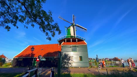 Beautiful-low-angle-shot-of-a-windmill-on-a-building-in-Zaanse-Schans,-Netherlands