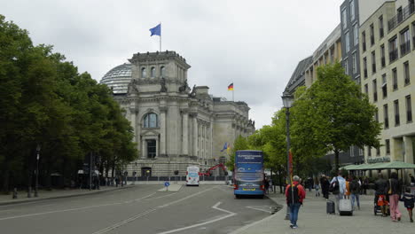POV-shot-walking-toward-the-Reichstag-of-Berlin,-cloudy-day-in-Germany