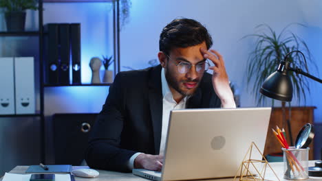 Irritated-tired-businessman-working-on-laptop-website-problem,-computer-virus-data-loss-by-hacking
