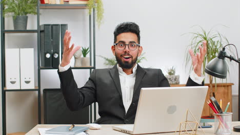 Excited-amazed-Indian-businessman-looking-shocked-surprised-wow-showing-head-explosion-gesture