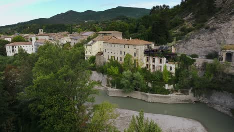 Aerial-view-of-small-village-of-Saillans,-river-Drôme