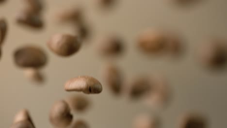 Coffee-beans-are-falling-close-up