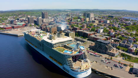 Aerial-over-Saint-John,-New-Brunswick-with-the-Oasis-of-the-Seas-in-port