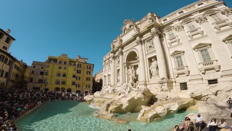 Slow-Motion-Panning-Shot-Reveals-Crowds-of-Tourists-at-Trevi-Fountain-in-Rome,-Italy