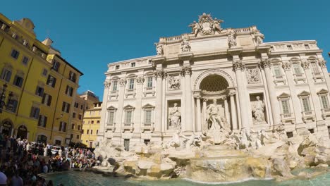 Pan-Right-Reveals-Famous-Trevi-Fountain-Tourist-Destination-on-Sunny-Day-in-Rome,-Italy