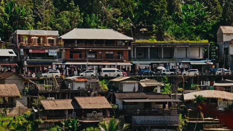 A-small-mountain-village-near-Ubud-in-Bali-with-cars-and-small-shops